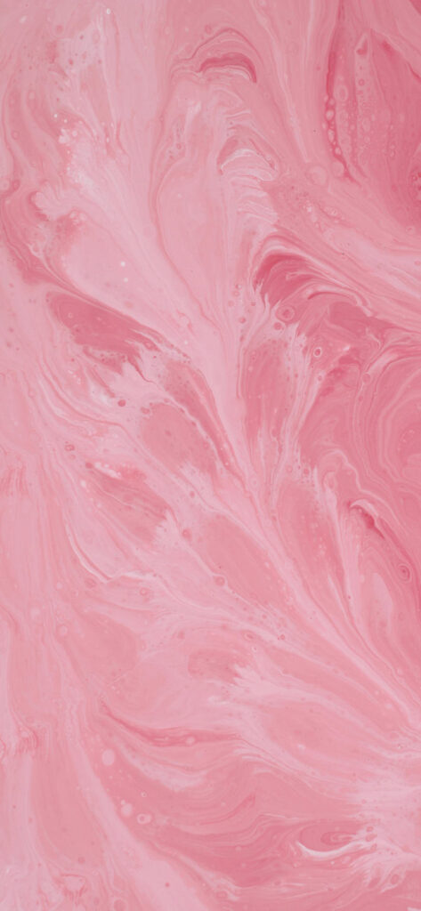 A close-up of a pink marbled texture with swirling patterns. Free Valentines Aesthetic Wallpapers.

